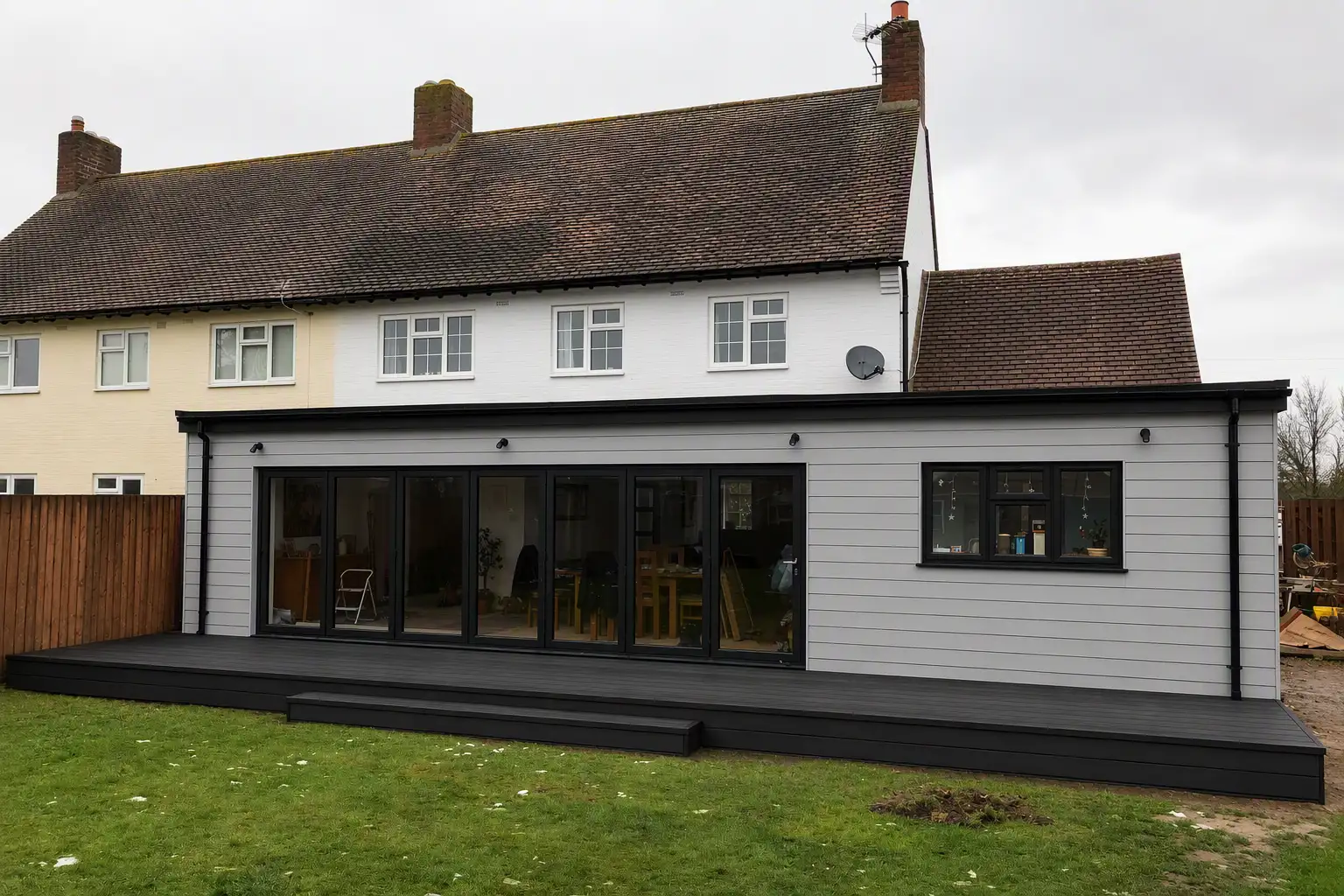 Clad single storey extension with decking